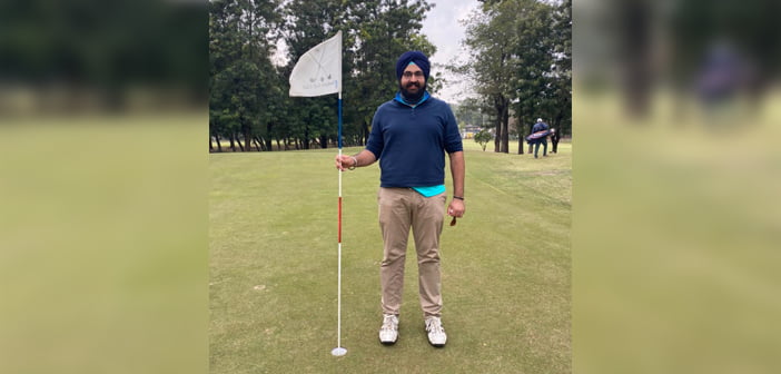 Pukhraj Singh Brar posing after acing the par-4 17th at CGC
