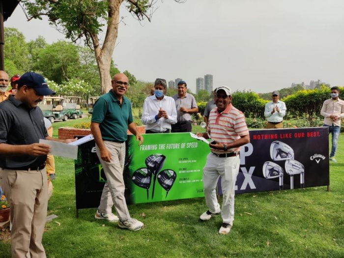 Caddie Bijender receiving his Best Gross Trophy