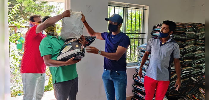 Chikkarangappa S. (Centre) providing help to Eagleton caddies