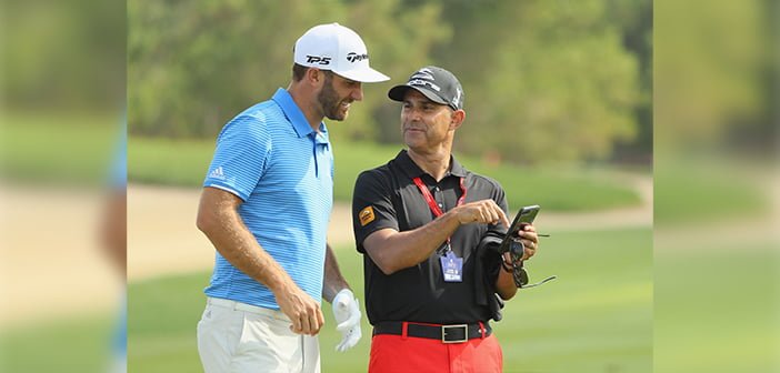 Dustin Johnson with Claude Harmon III | Photo: Golf Digest