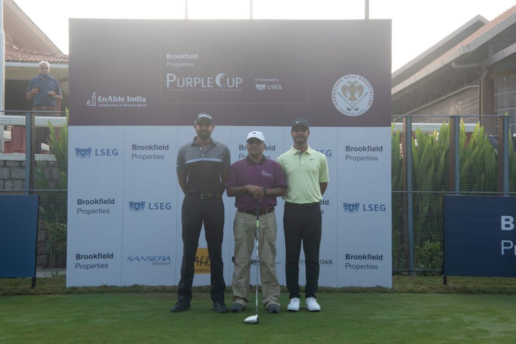 Khalin Joshi (L) & Shubhankar Sharma (R) with a participant at the Purple Cup in Bangalore
